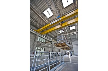 Crane in use as a hoist for lifting components of the company Rolls-Royce 