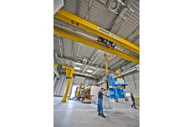 Crane in use as a hoist for lifting components of the company Rolls-Royce 