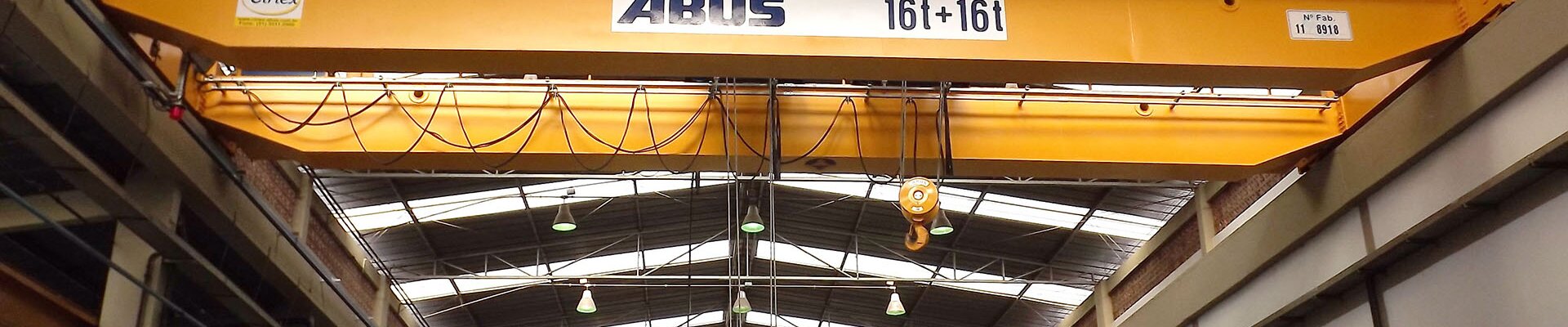 ABUS crane with electric wire rope hoists and a load capacity of 16 t and 16 t in a company for internal transport of loads in Brazil.