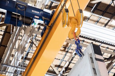 Close up of wire rope hoist on working double girder travelling crane