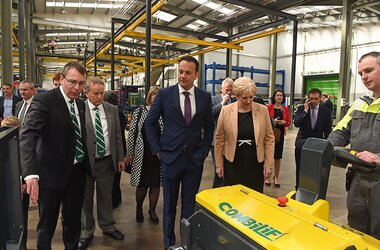 Suspended rail systems in production hall of Combilift company during guided tour 